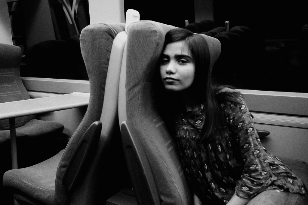 Indian girl on train at night